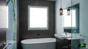 Tilt and turn windows with white frame in Bathroom at APS Double Glazing