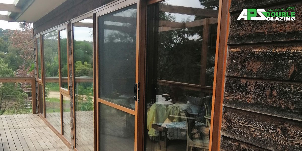 Sliding Doors in Wood Grain frame at APS Double Glazing