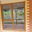 UPVC Awning Window with woodgrain frame at APS Double Glazing