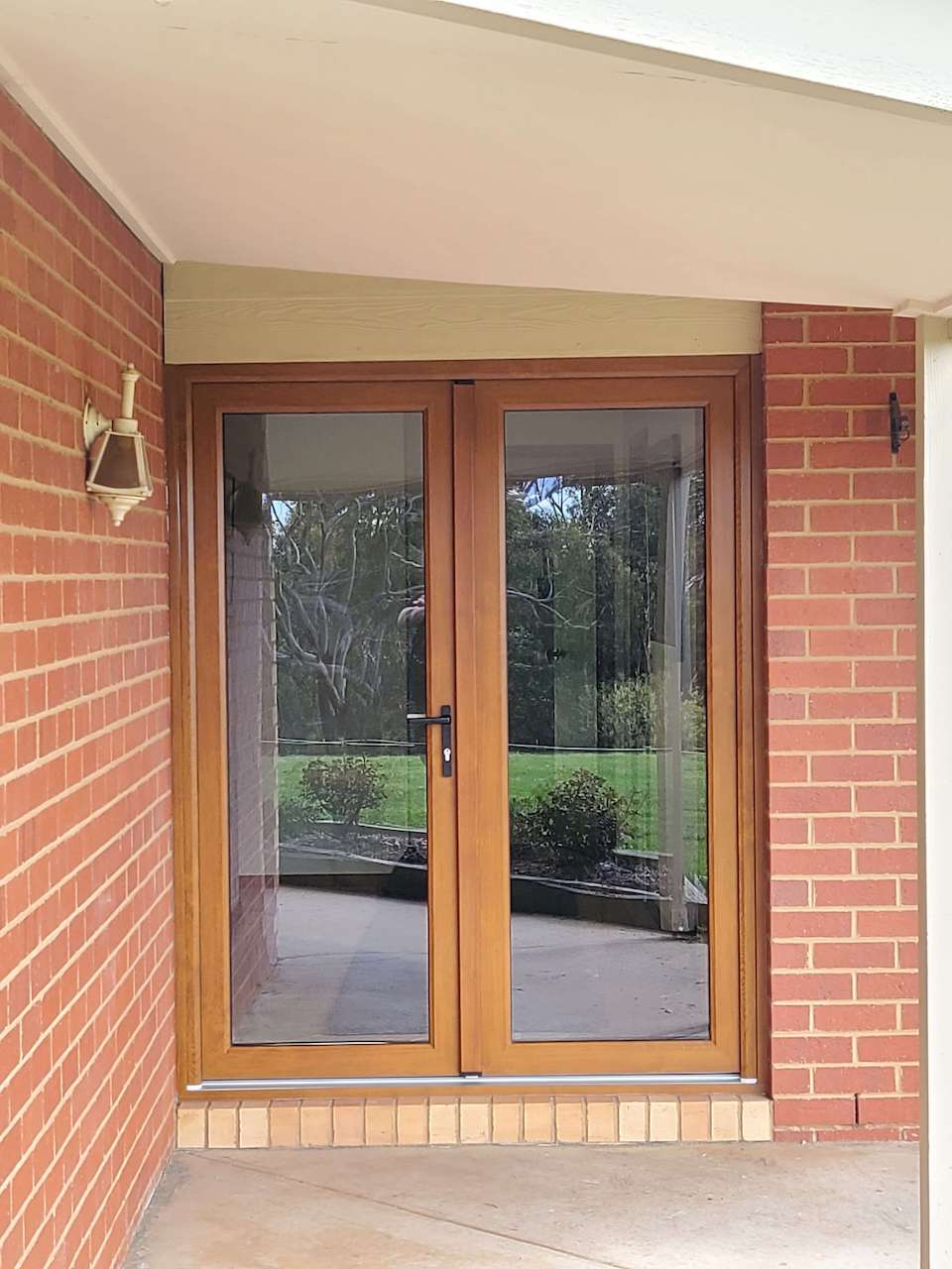 French and Double Doors with woodgrain frame at APS Double Glazing