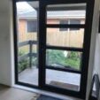 Front and Entrance Doors with black frame at APS Double Glazing