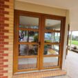 Front and Entrance Doors with woodgrain frame at APS Double Glazing
