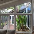 Shaped Windows with silver frame at APS Double Glazing