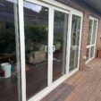 Sliding and Patio Doors outside with white frame at APS Double Glazing
