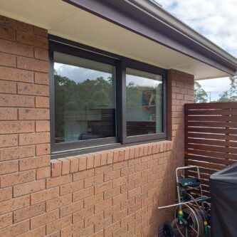 Fixed-picture-windows-with-energy-efficient-double-glazed-glass-units-in-black-exterior-UPVC-frames-Kitchen